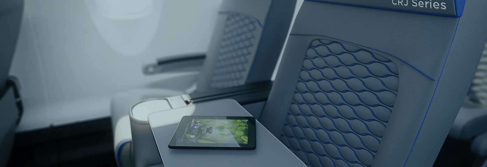 Siège d'un avion série CRJ de Mitsubishi Heavy Industries avec tablette mobile